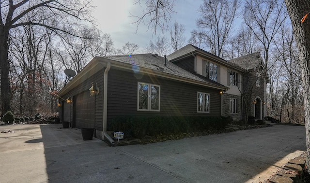 view of side of property featuring a garage