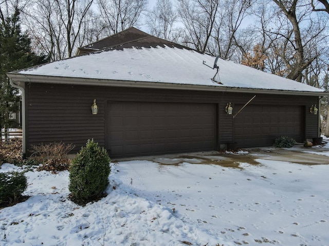 view of snow covered garage