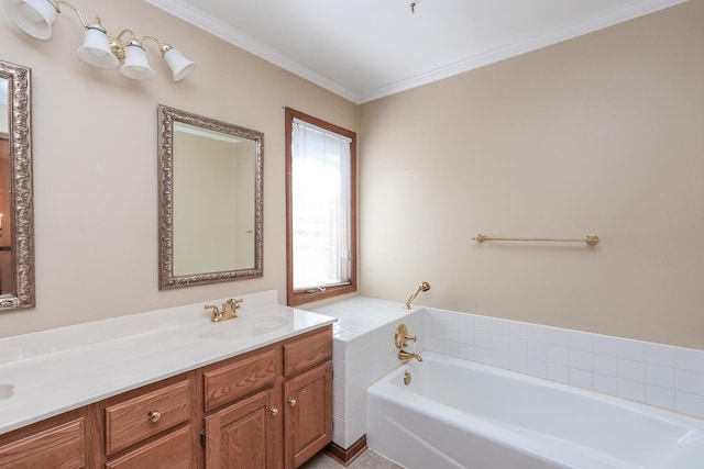 bathroom featuring vanity, crown molding, and a bathtub