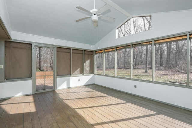 unfurnished sunroom featuring vaulted ceiling with beams and ceiling fan