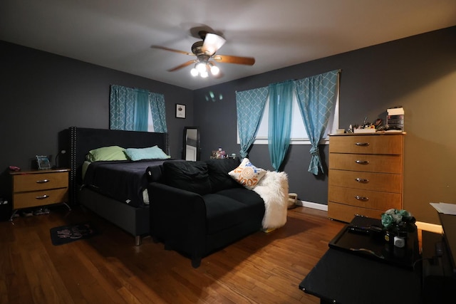 bedroom with wood-type flooring and ceiling fan