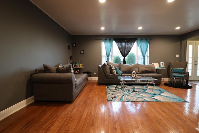 living room with light hardwood / wood-style flooring and french doors