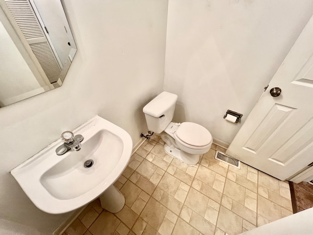 bathroom with toilet and sink