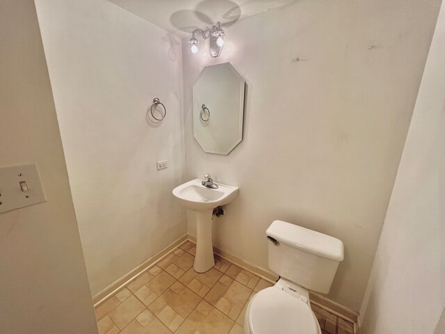 bathroom with toilet and sink