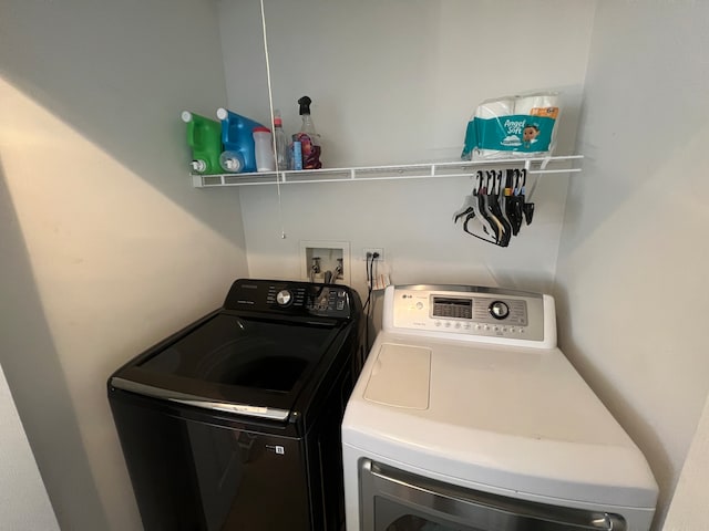 clothes washing area featuring washing machine and dryer