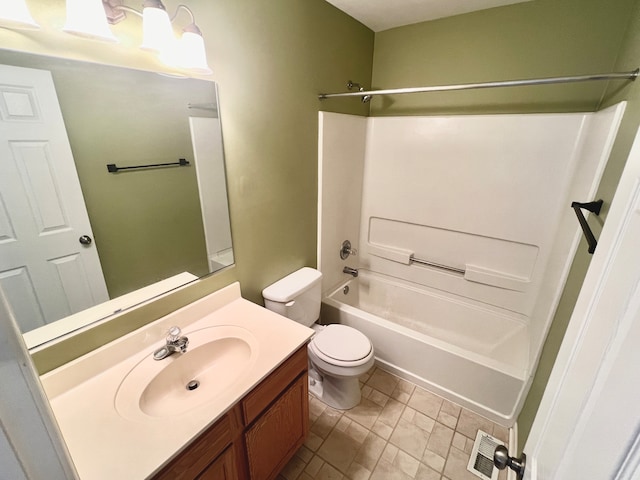 full bathroom featuring bathing tub / shower combination, vanity, and toilet