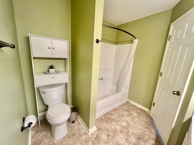 bathroom featuring shower / bath combination with curtain and toilet