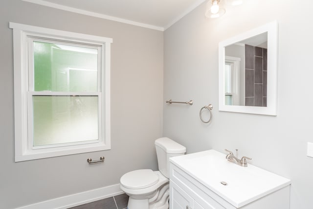 bathroom featuring ornamental molding, tile patterned flooring, vanity, and toilet