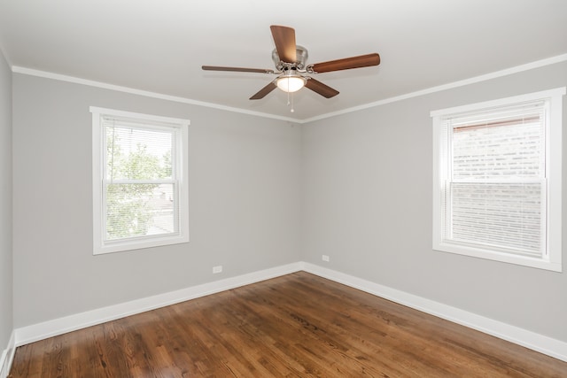 unfurnished room featuring hardwood / wood-style flooring, ceiling fan, and crown molding