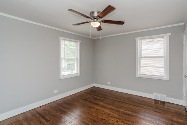 empty room featuring ceiling fan, dark hardwood / wood-style floors, and crown molding