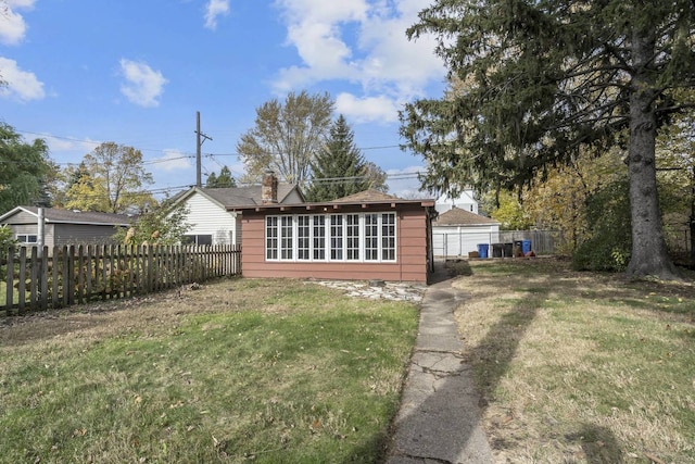 2206 W Lunt Ave, Chicago, IL 60645 - rear view of property featuring a chimney