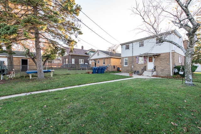 exterior space with a yard and a trampoline