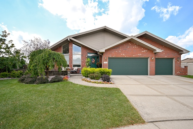 view of front of property with a front yard and a garage