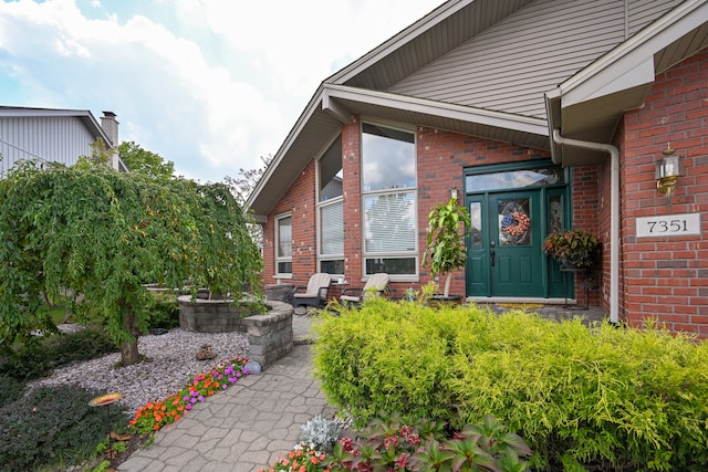 property entrance with a patio