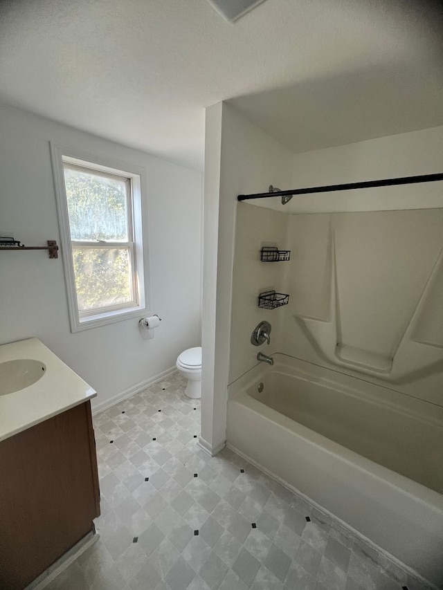 full bathroom with vanity, washtub / shower combination, and toilet