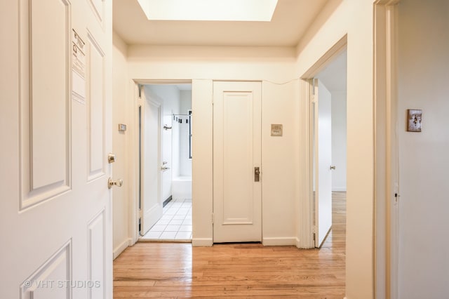 corridor featuring light hardwood / wood-style floors