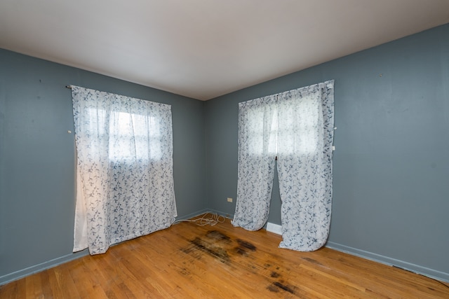 empty room featuring hardwood / wood-style flooring