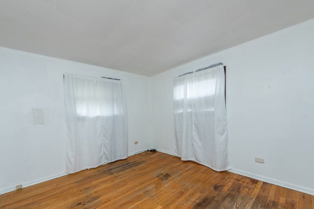 unfurnished room featuring wood-type flooring