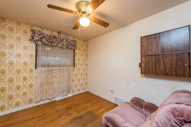 sitting room featuring hardwood / wood-style flooring and ceiling fan