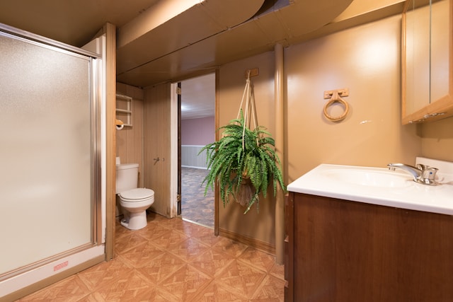 bathroom featuring walk in shower, vanity, and toilet