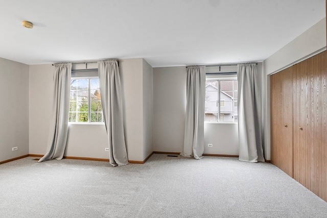 empty room with carpet flooring