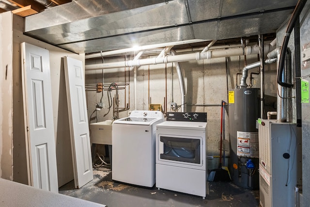 laundry room featuring separate washer and dryer and gas water heater