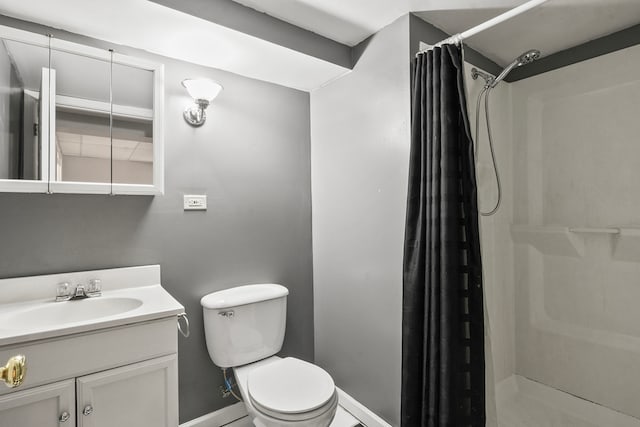 bathroom featuring toilet, a shower with curtain, and vanity