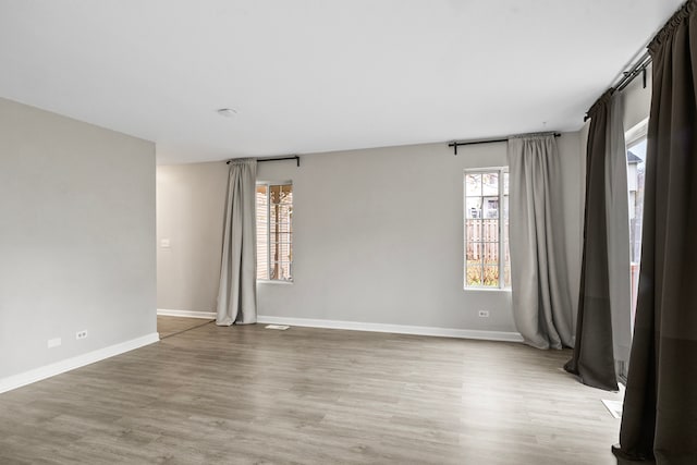 spare room with light wood-type flooring