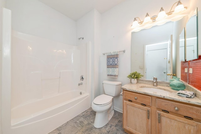 full bathroom featuring vanity, bathing tub / shower combination, and toilet