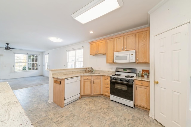 kitchen featuring crown molding, sink, white appliances, and kitchen peninsula