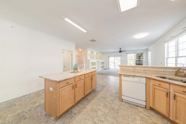 kitchen with dishwasher, sink, ornamental molding, a center island, and ceiling fan