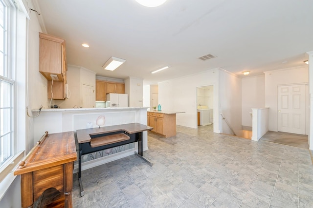 kitchen featuring crown molding, white appliances, kitchen peninsula, and light brown cabinets