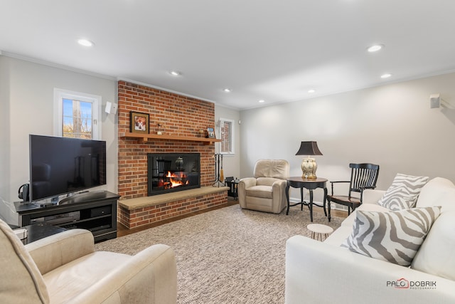 carpeted living room featuring a brick fireplace and ornamental molding