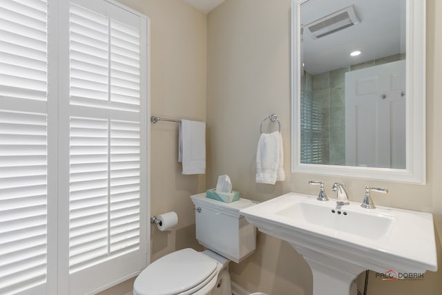 bathroom with toilet and sink