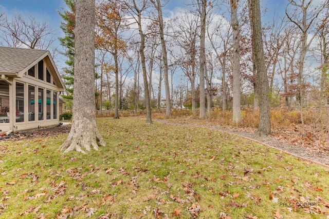 view of yard with a sunroom