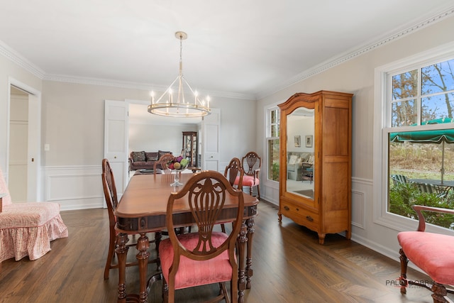 dining area featuring a chandelier, dark hardwood / wood-style flooring, and ornamental molding