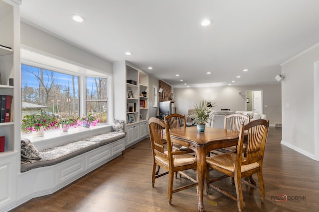 dining area with crown molding and dark wood-type flooring