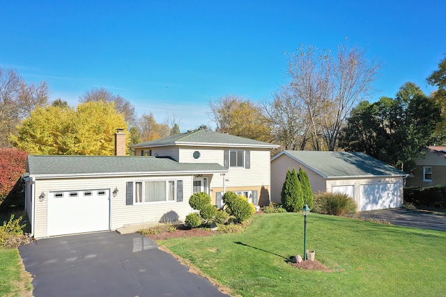 view of front of property with a garage and a front yard