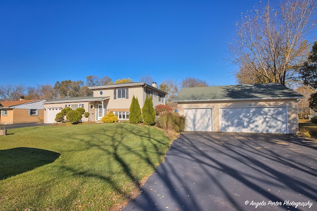 split level home featuring a garage and a front yard