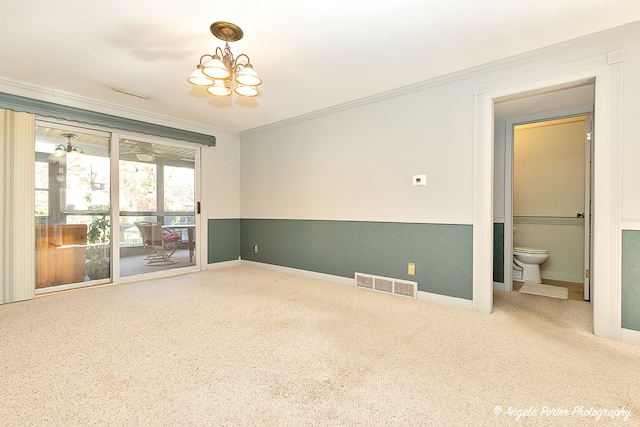 unfurnished room featuring a notable chandelier and crown molding