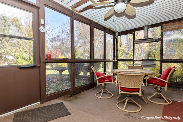 sunroom featuring ceiling fan