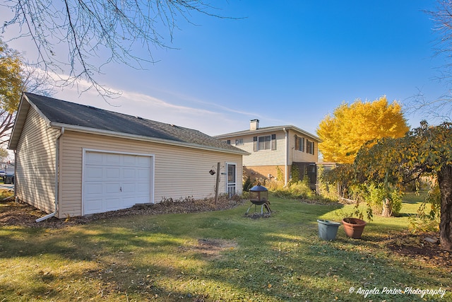 view of front of house with a garage and a front yard