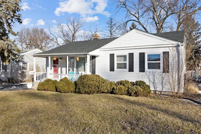 view of front of house featuring a front yard and covered porch