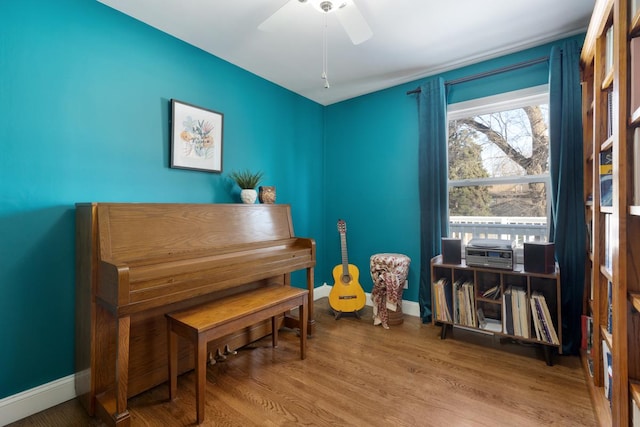 miscellaneous room featuring ceiling fan and hardwood / wood-style floors