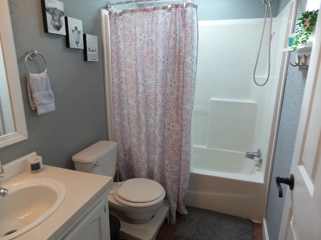 full bathroom featuring vanity, toilet, and shower / bath combination with curtain