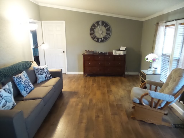 living room featuring dark hardwood / wood-style floors and crown molding