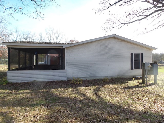 view of property exterior with a yard