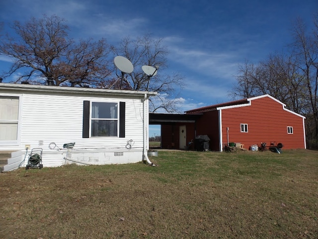 view of side of home featuring a yard