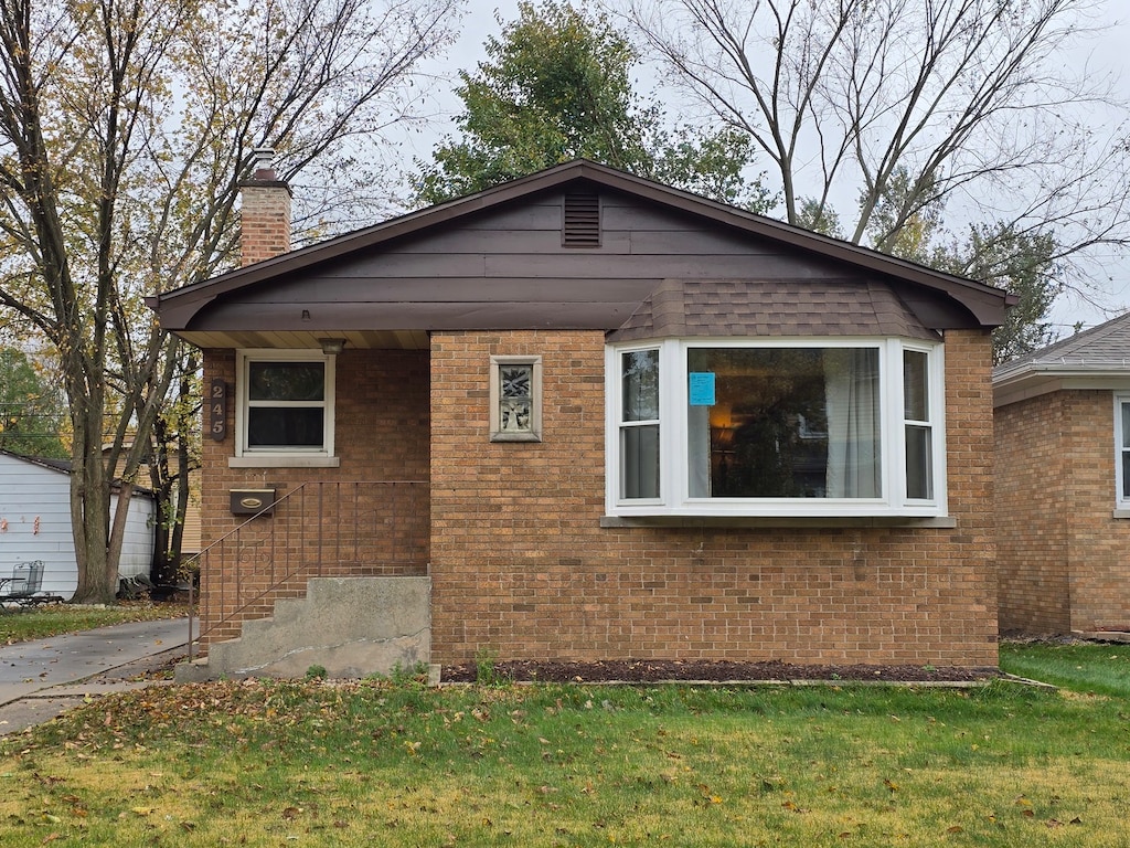 view of property exterior with a yard