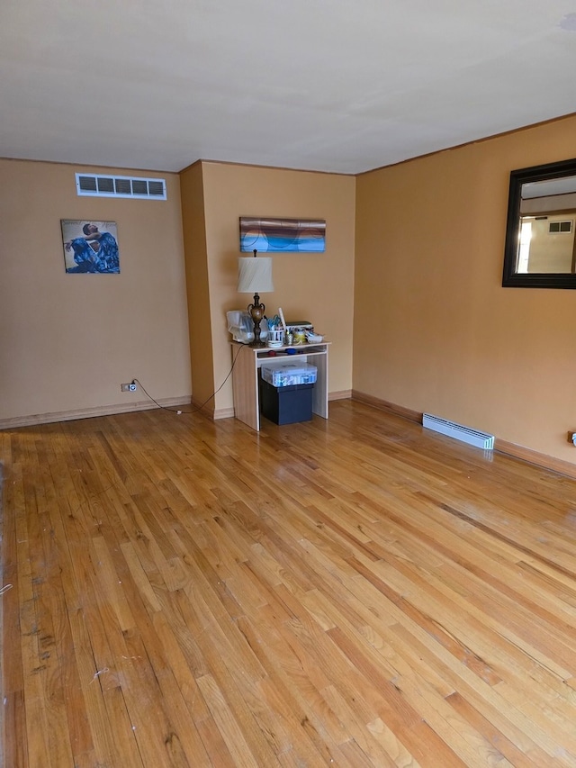 unfurnished living room with light wood-type flooring